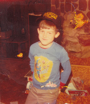 Travis Dewitz as a Child With Dewitz Auto Hat On