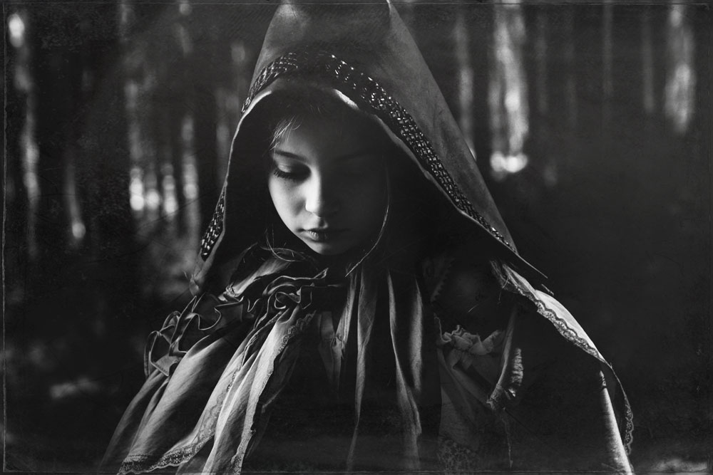 Red Riding Hood Stares Down and Reflects Back Into the Calmness of Her Thoughts