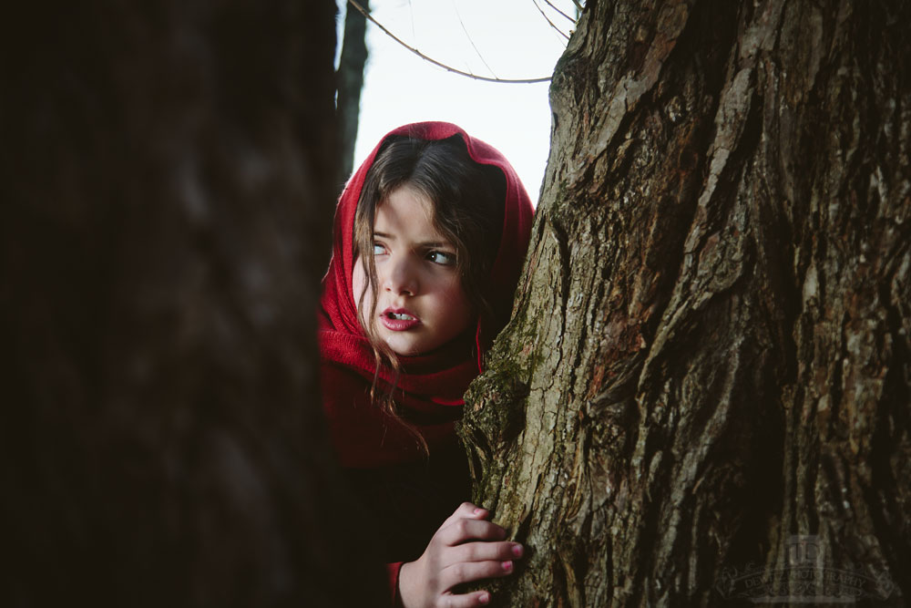 Red Riding Hood Behind a Tree