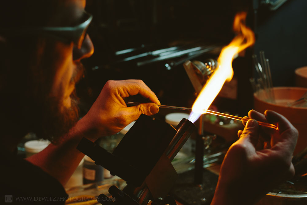 christensen_glass_melting_glass_rods_over_flame