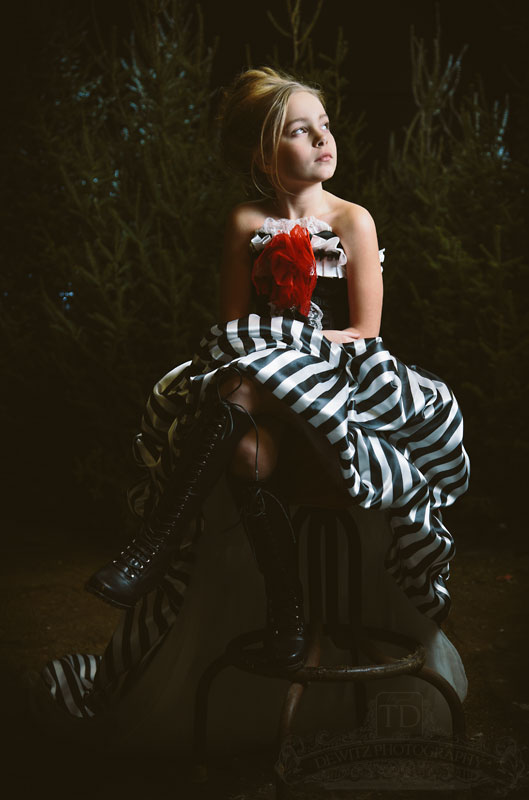 Teslyn on stool wearing Bentley and Lace dress and tall boots