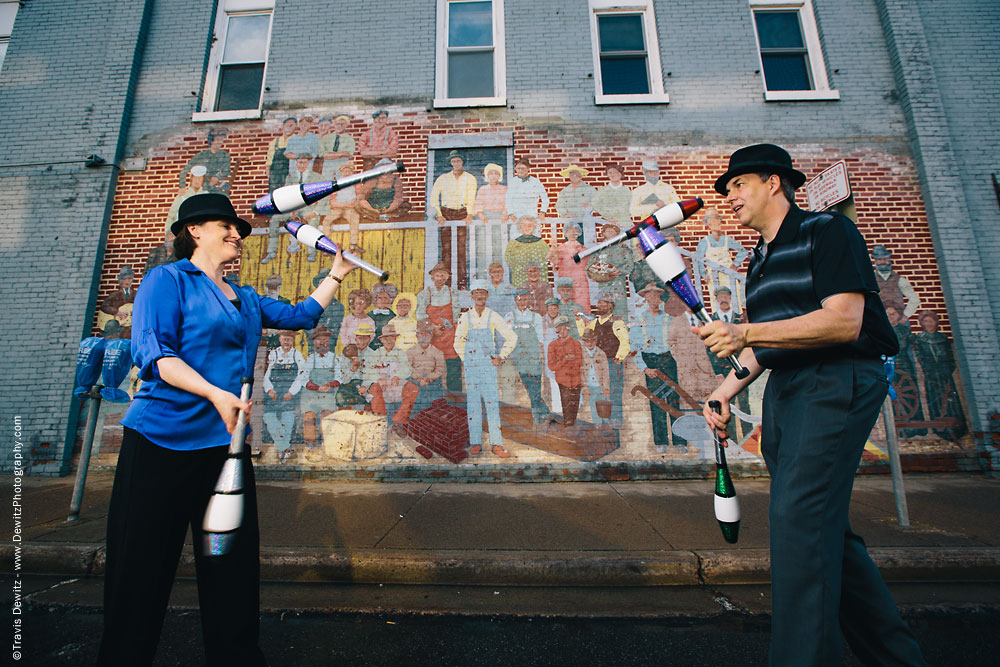 In Capable Hands Juggling in Front of People Painted on Brick Wall in Menomonie Wisconsin