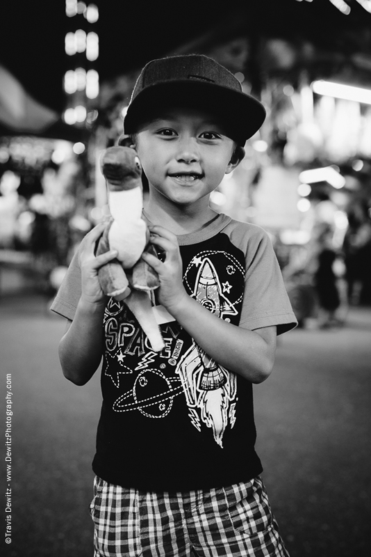 Northern Wisconsin State Fair Boy With Stuffed Dinosaur