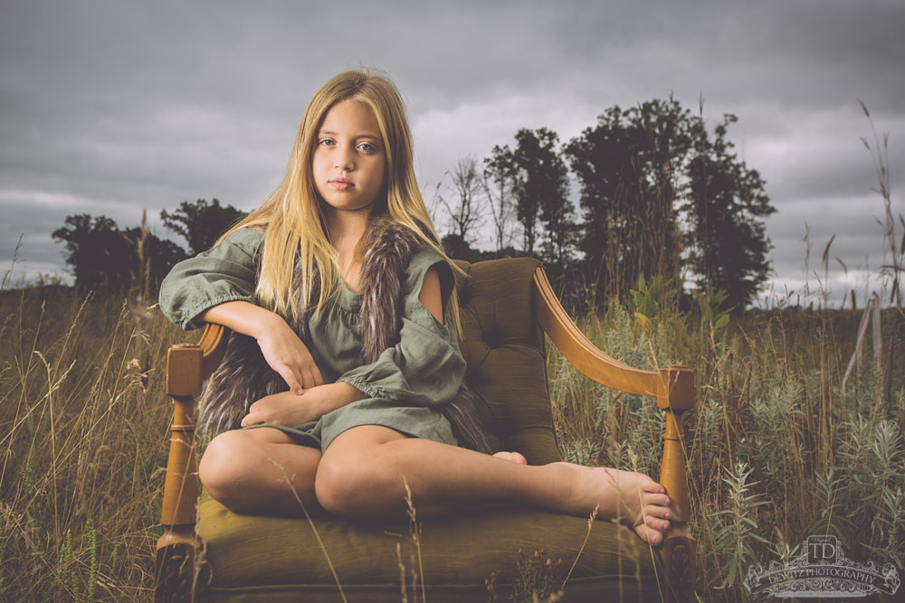 madalina_sitting_in_vintage_chair_in_field_web