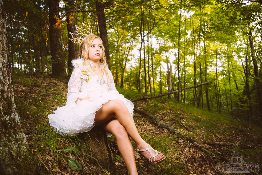 madalina_sitting_on_wooded_hillside_web