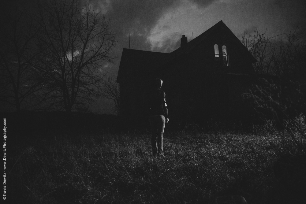 Girl Standing in the Dark