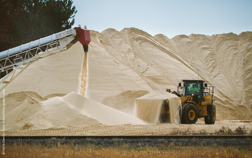 Front End Loader Scooping Sand