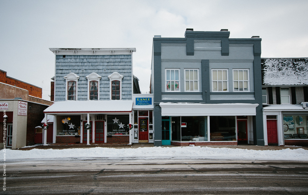 The oldest commercial building left in Chippewa Falls (pictured here on the left) is now blue but still retains its false front. It was built in 1859 by Peter Morie and was the location in the city that citizens would register for the Civil War.