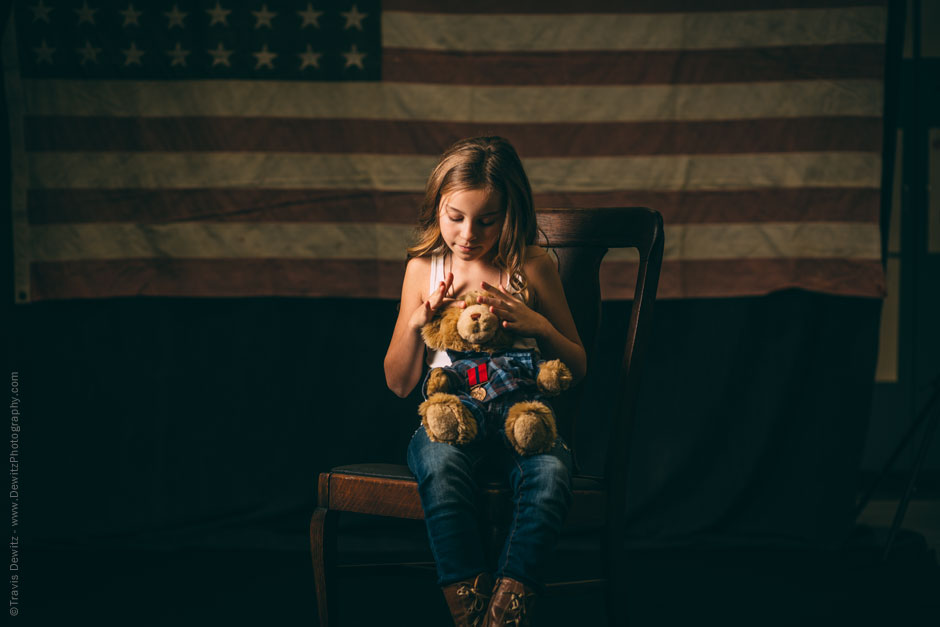 Teslyn Sitting on Antique Chair and Vintage American Flag Holding Teddy Bear