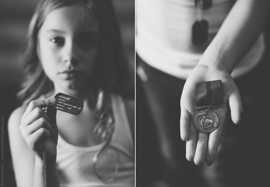 Teslyn holds her Grandpas USMC Dog Tags and War Medal