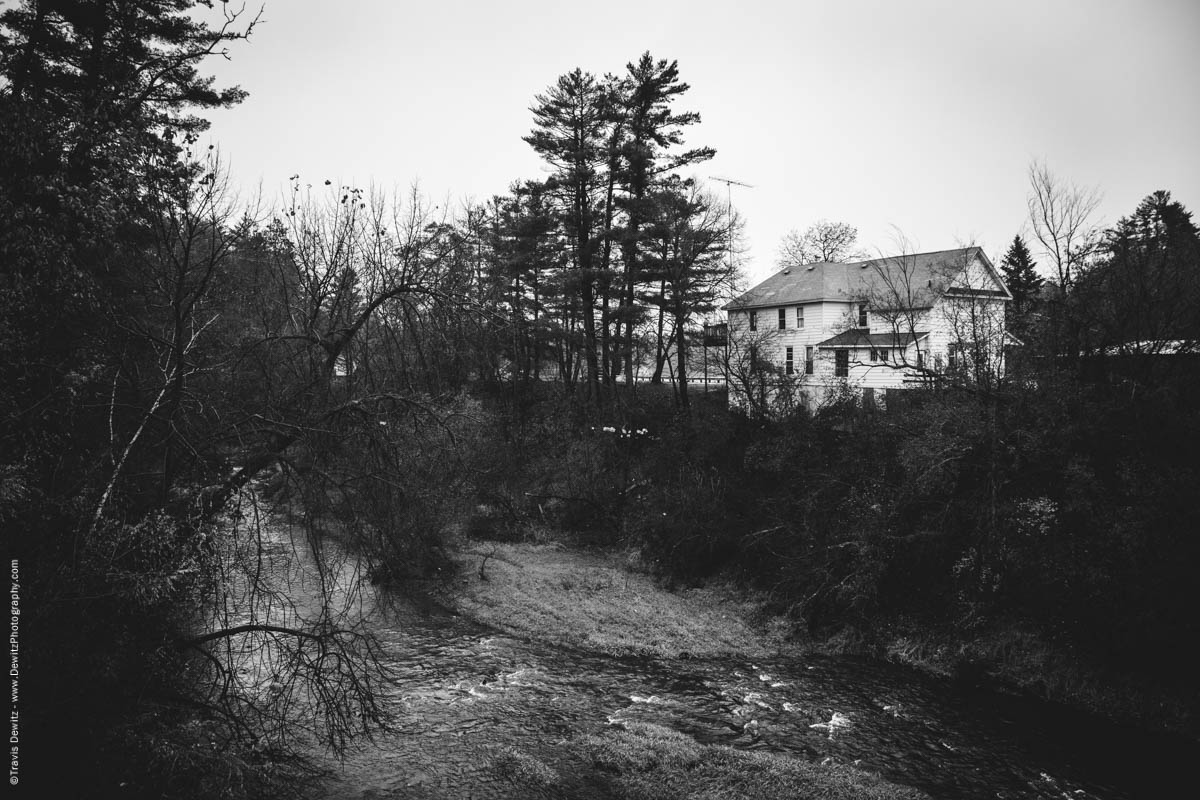 large-old-home-build-overlooking-creek-elk-lake-wi-historic-city