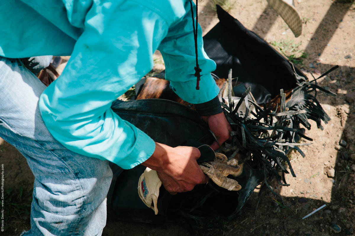 3-Bull Rider Gets Equipment Ready -3033