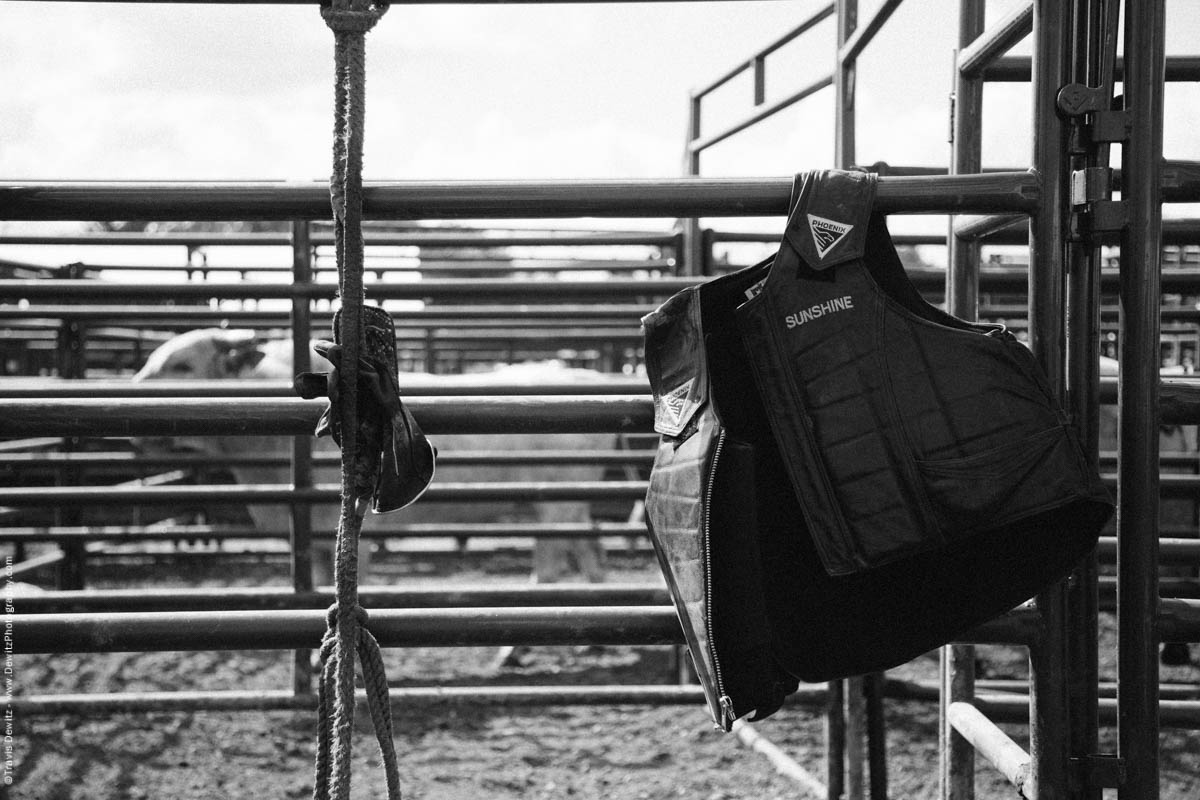 74-End of Day Bull Riding Vest Hangs on Fence Embroidered Sunshine-3388