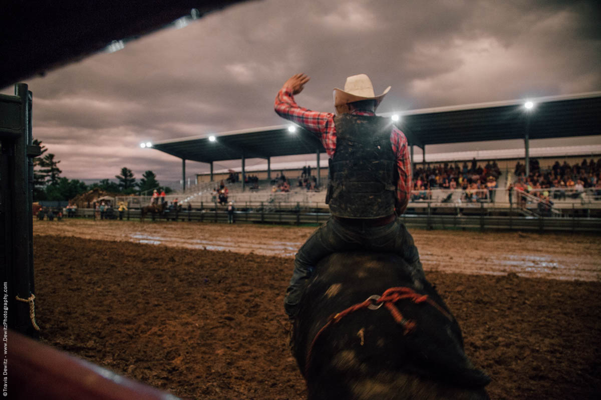 bull-rider-on-bucking-bull-hand-up-5083