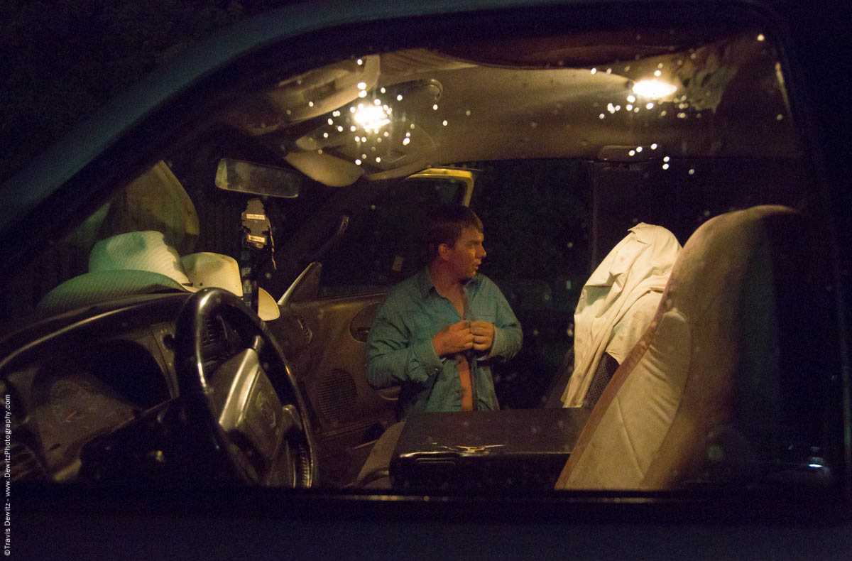 cowboy-changes-in-his-truck-after-wet-rainy-bull-riding-event-at-night-5767