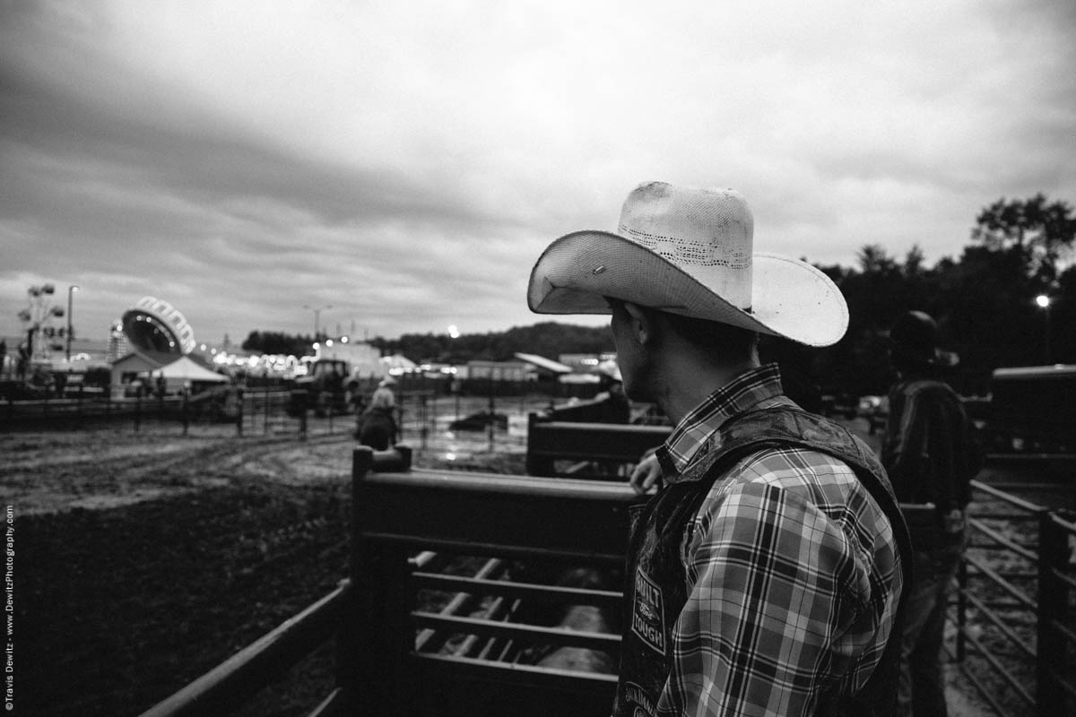 cowboy-looks-out-over-muddy-arena-fair-grounds-4956
