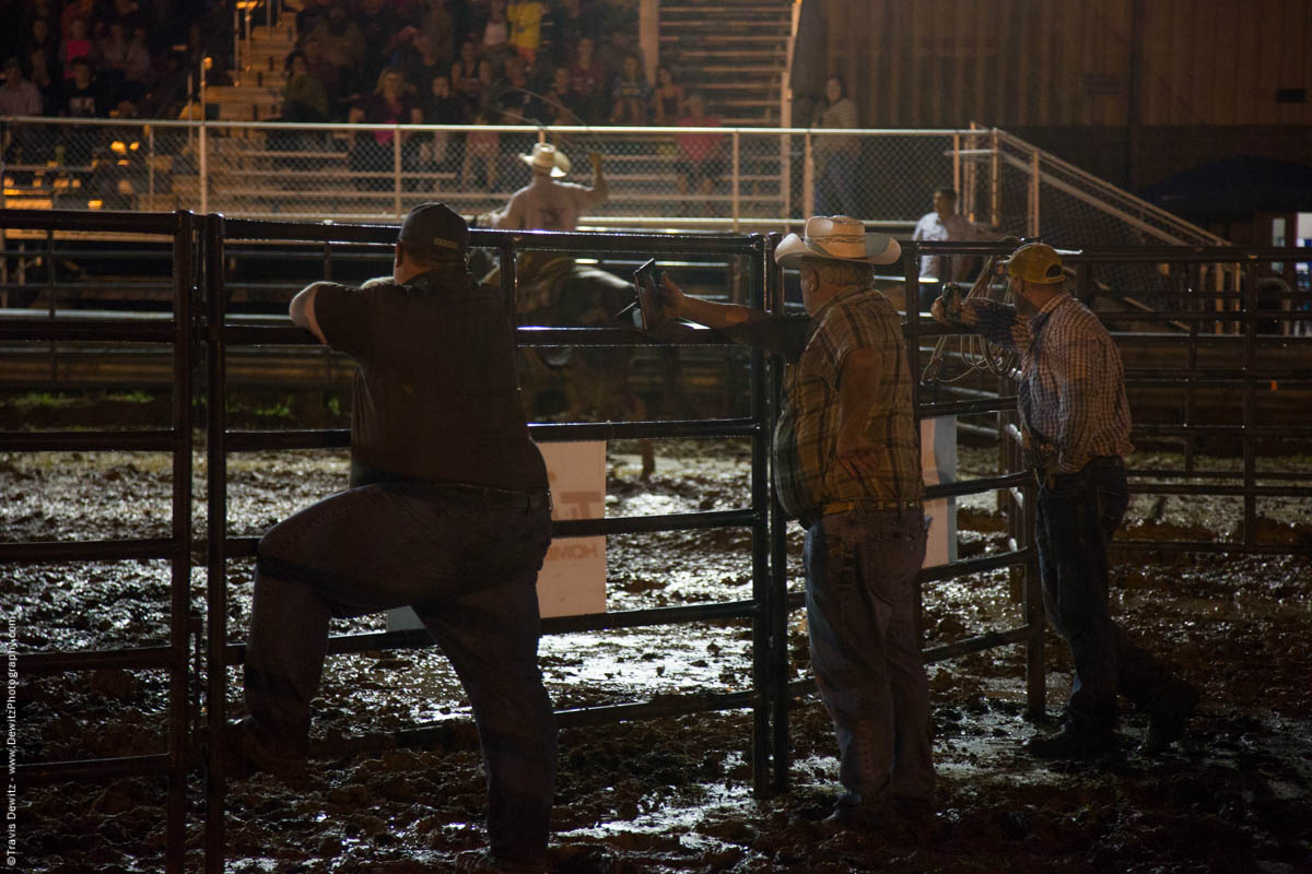 men-watch-rodeo-in-mud-5277