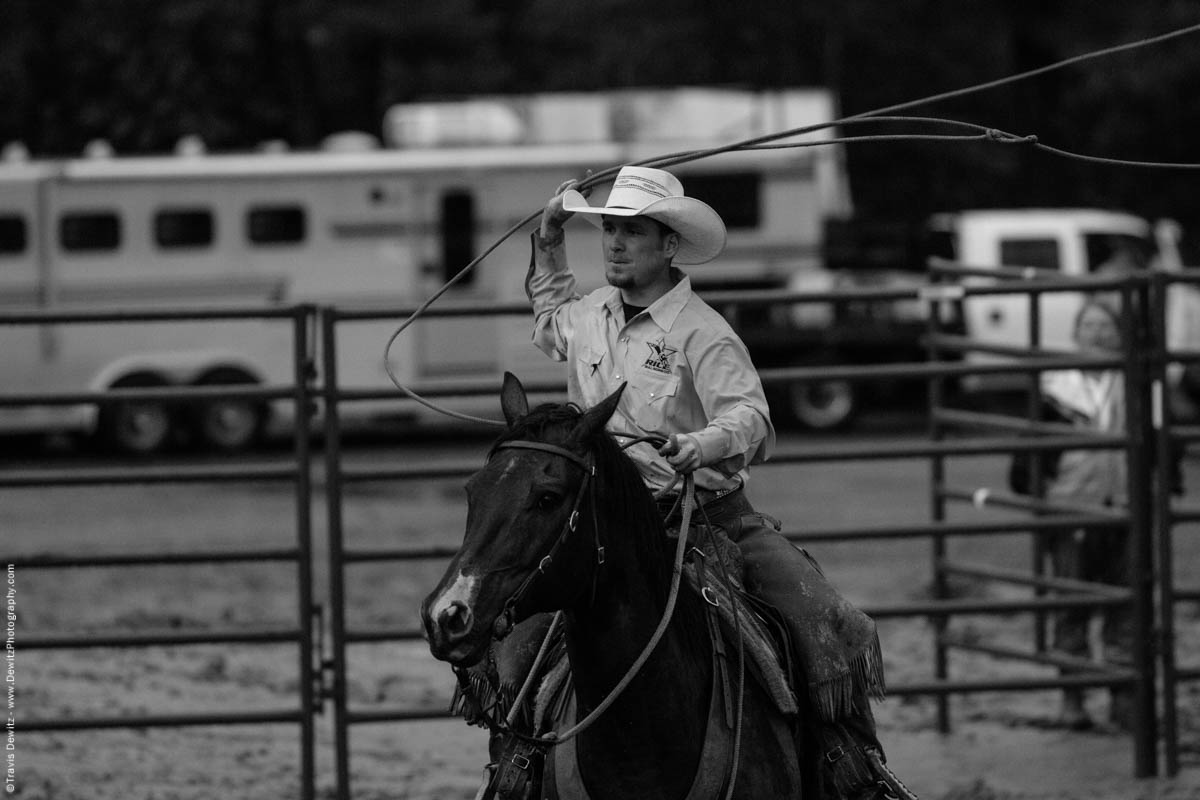 rice-bull-riding-cowboy-swings-lasso-on-horse-7651